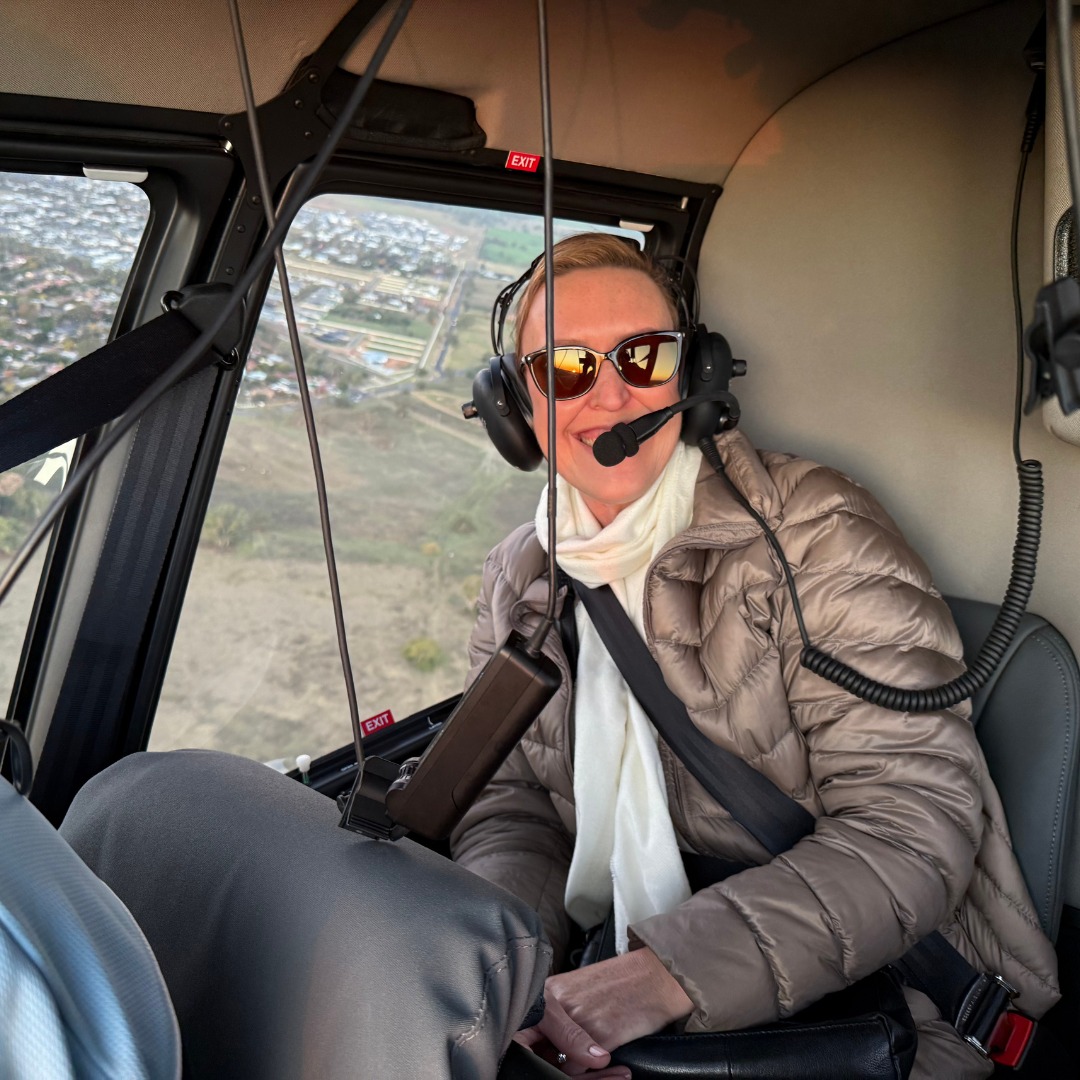 Dr Liesel Ryan on a helicopter flight
