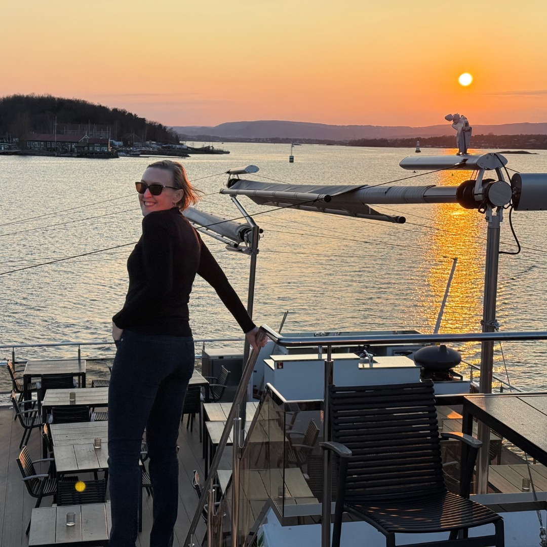 Dr Liesel Ryan on a sunset boat deck
